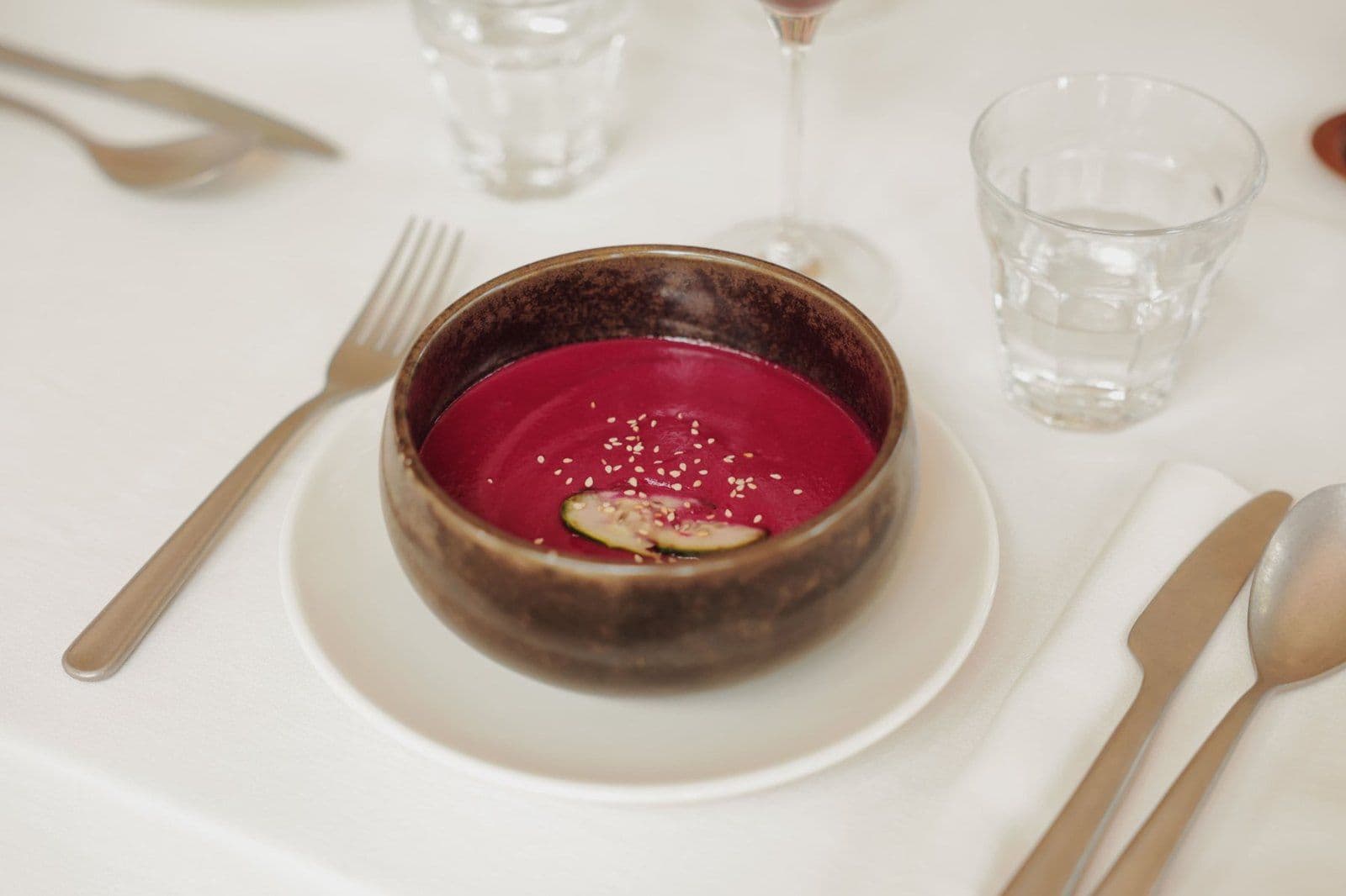 Beetroot cream served in a ceramic bowl