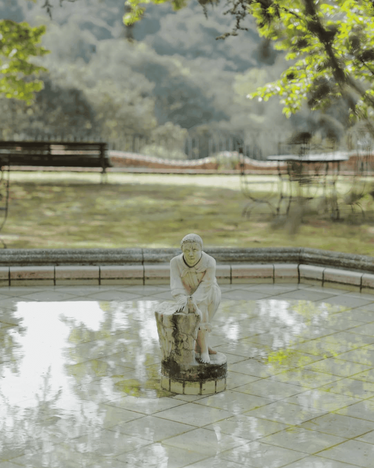 Stone statue at the garden fountain of Casa Virupa