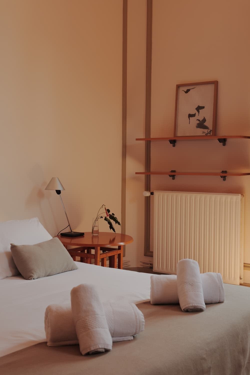 Towels folded on the bed of a room