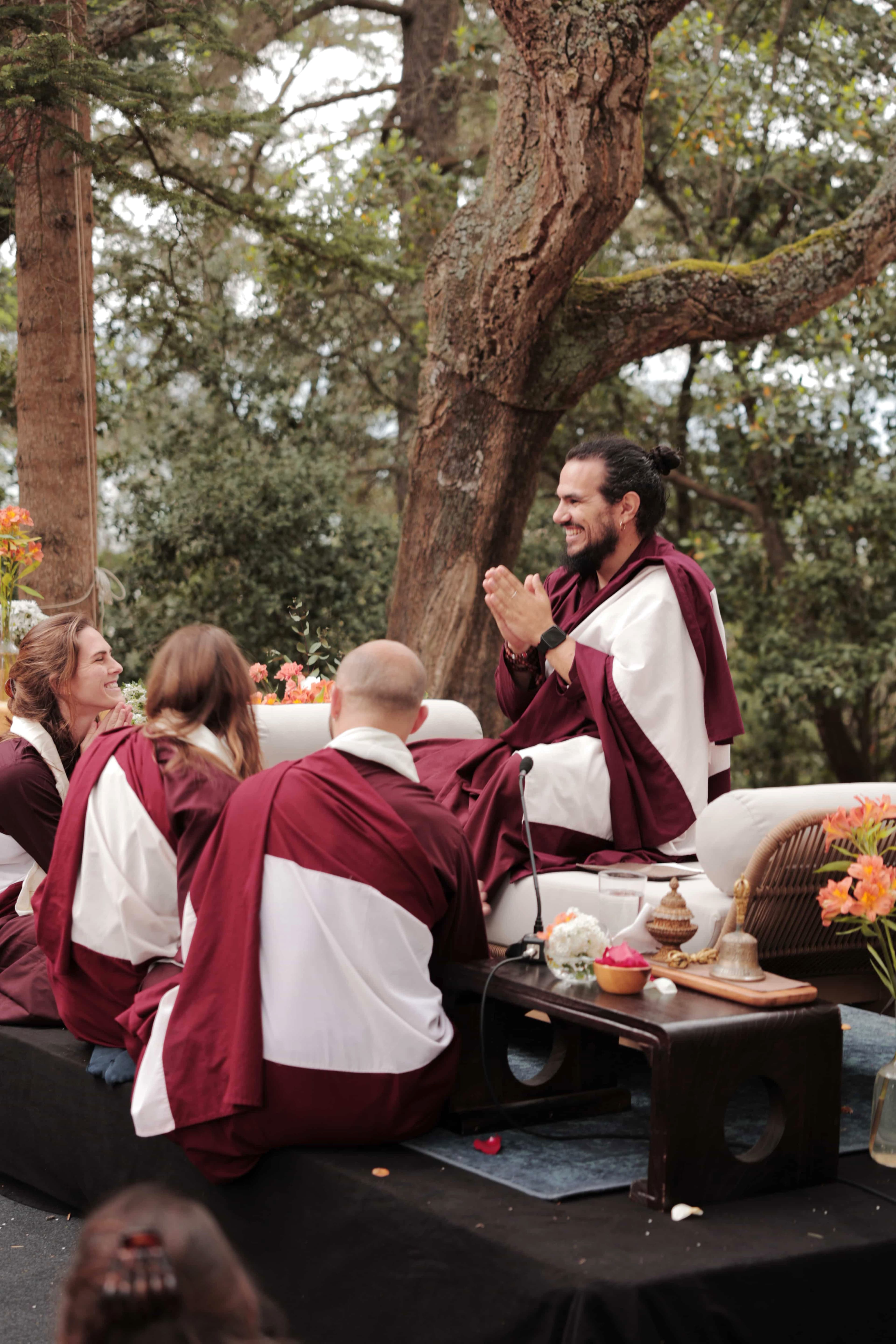 Lama Norbu with members of the community during an outdoor ritual